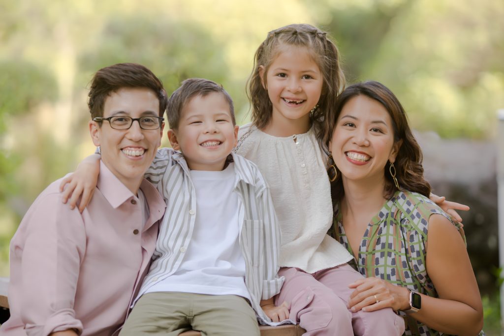 Jenni and Lisa with their two children, representing the modern family and the freedom financial planning can create.